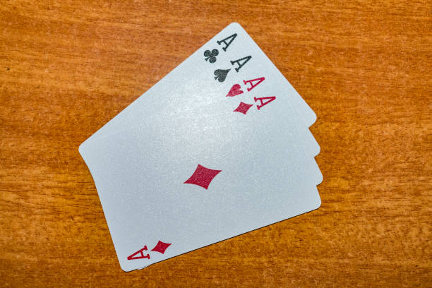 A set of all four nos of ace of Playing card laying on the table with an arrangement. stock photo