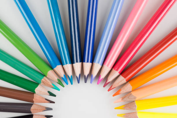 set of colored pencils lined by an arc stock photo
