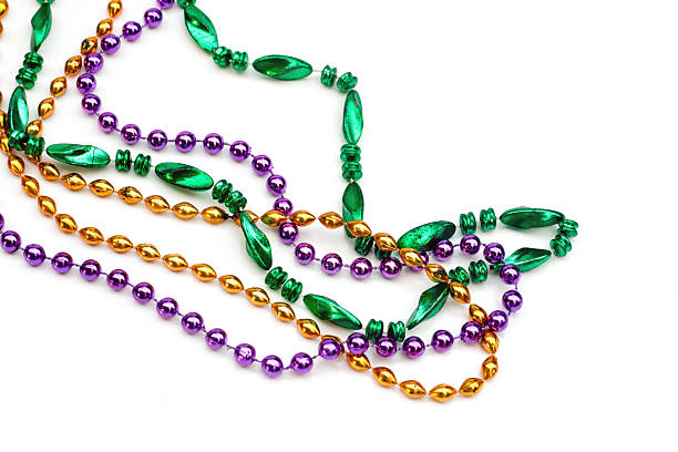 Set of colorful beads over a white background http://img.photobucket.com/albums/h135/KathrynE8/mardigrasbeadsbanner.jpg bead stock pictures, royalty-free photos & images