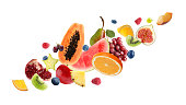 istock Set of different cut fresh fruits and berries on white background 1341417927