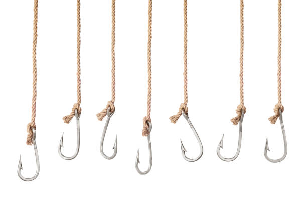 Set of fishing hooks on the ropes isolated on a white background Set of fishing hooks on the ropes isolated on a white background. 3d illustration hook stock pictures, royalty-free photos & images