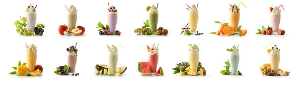 Set of milkshakes decorated with fruits of various flavors isolated stock photo