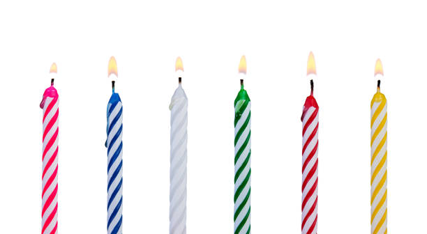 Set of multicolored candles for festive cupcake isolated on white background stock photo