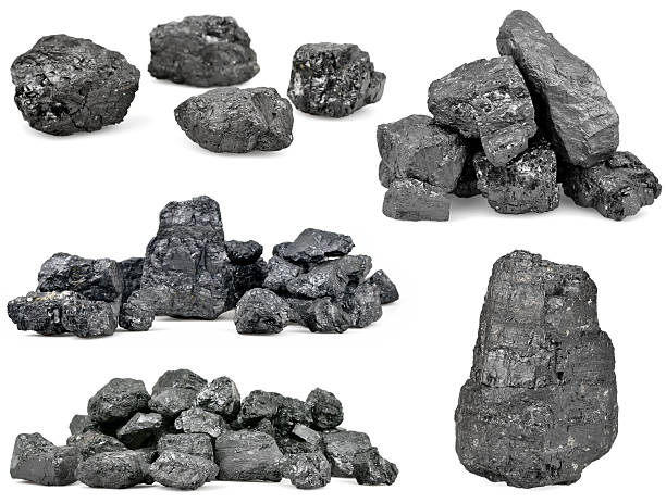 Set of piles of coal isolated on white stock photo