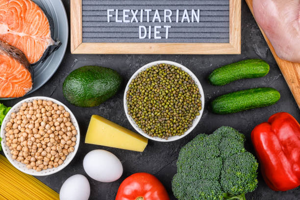 A set of products for a flexible diet. Felt plate with the inscription, a circle of vegetables, cereals and fish. Proper nutrition. stock photo