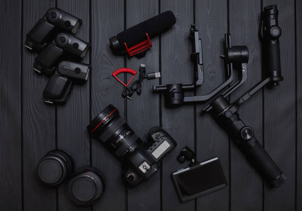 set of professional video and photo dslr camera equipment with motorized gimbal stabilizer and accessories stock photo