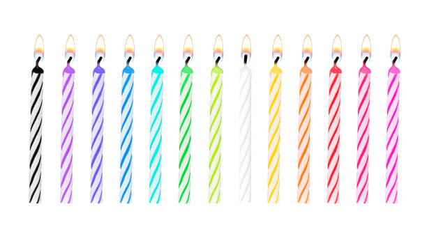 Set of rainbow color birthday or party candles were lit and isolated on white background with clipping path for celebration Set of rainbow color birthday or party candles were lit and isolated on white background with clipping path for celebration on special occasion birthday candle stock pictures, royalty-free photos & images