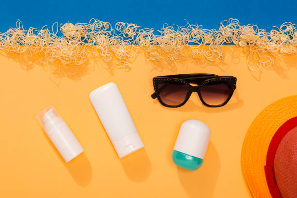 Set of sunblock moisturizer and spray to protect from sunlight on the beach. stock photo