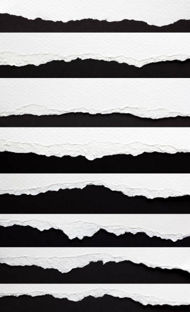 set of torn paper edges set of torn paper edges isolated on black imperfection photos stock pictures, royalty-free photos & images