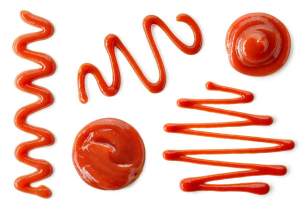 Set of various tomato sauce or ketchup splashes Set of various tomato sauce or ketchup splashes isolated on white background. Top view ketchup smear stock pictures, royalty-free photos & images