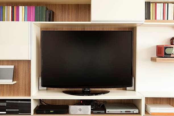 TV set on wall unit stock photo