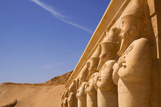Seven statues look out over the nile luxor west bank  nile river stock pictures, royalty-free photos & images