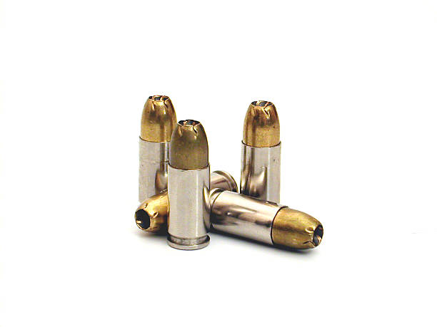 Several bullets isolated on a white background several 9mm hollow point bullets ammunition stock pictures, royalty-free photos & images