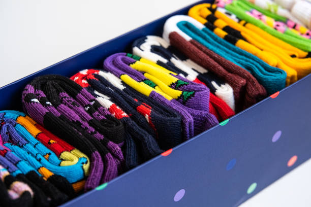 Several colorful cotton socks rolls in a box stock photo