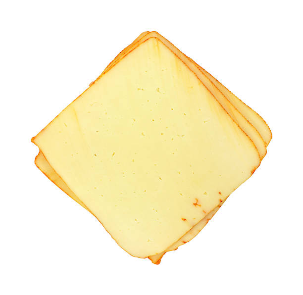 Several slices of muenster cheese Several slices of muenster cheese on a white background. muenster cheese stock pictures, royalty-free photos & images