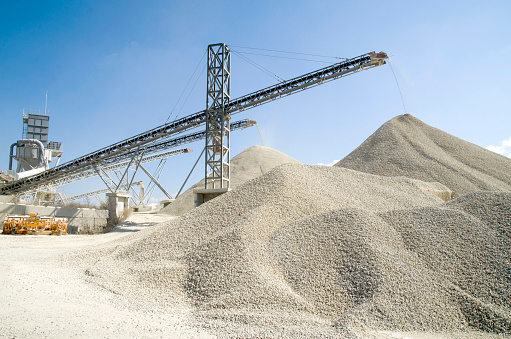 Several working belt conveyors and a piles of rubble in Gravel Quarry