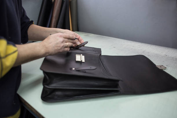 Sewing leather handbag stock photo