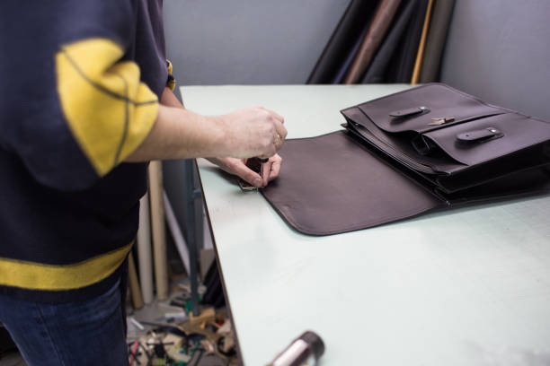Sewing leather handbag stock photo