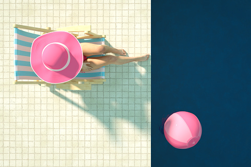 3d rendering of swimming pool. Summer Concept. Travel destinations. Sexy girl in a pink color bikini sunbathing in the pool. Beach Ball. Aerial view.