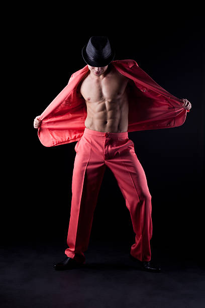 sexy hombre en traje rojo - male stripper fotografías e imágenes de stock