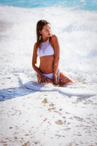 Sexy Young Carefree Woman wearing White Bikini stock photo
