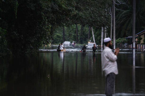Shah Alam, Malaysia-December 19, 2021: A scene where cars stranded and rescue mission in a badly affected area during a big flood that happened in a very unexpected area in Shah Alam and Klang. stock photo