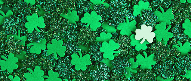 Shamrock confetti texture banner background filled with green and white lucky clovers. Happy St. Patrick's Day Spring 17 march Irish holiday backdrop