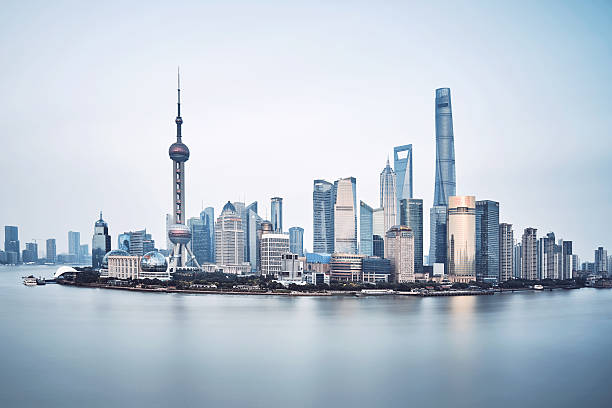 Shanghai, China Photo of modern buildings by river at dusk shanghai stock pictures, royalty-free photos & images