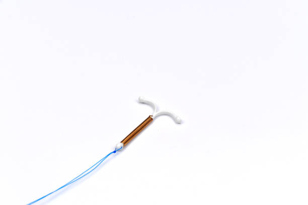 T shape IUD Gold hormon free  iud stock pictures, royalty-free photos & images