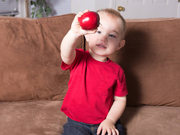 Sharing an apple! stock photo