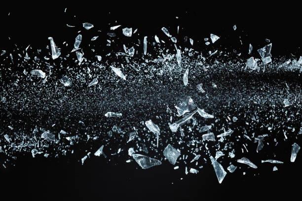 Shattered crystals flying Shattered crystals or glass in motion on black background, studio shot. destruction stock pictures, royalty-free photos & images