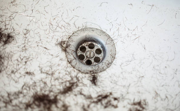 Shaved hairs in the washbasin with razor and trimmer. Hairdresser tools Shaved hairs in the washbasin with razor and trimmer. Hairdresser tools macro body hair stock pictures, royalty-free photos & images