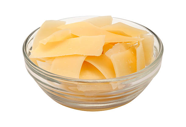 Shaved Parmesan Cheese in a glass bowl stock photo