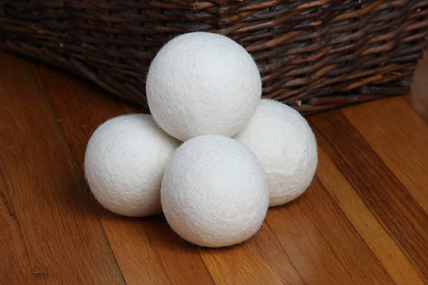 Sheep dryer ball Sheep dryer ball on wooden floor dryer stock pictures, royalty-free photos & images