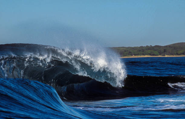 Sheer power and majesty of the incredible wave at Shark Island stock photo