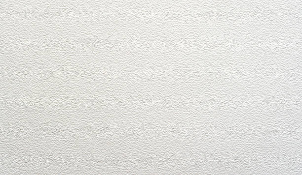 primer plano de hoja de papel de acuarela blanca - desigual con textura fotografías e imágenes de stock