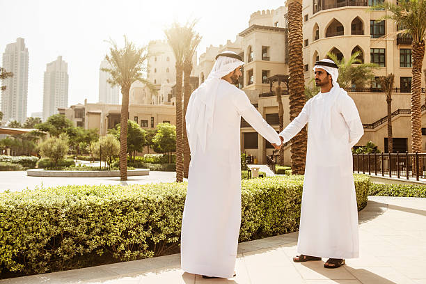 sheikh doing a deal in UAE stock photo
