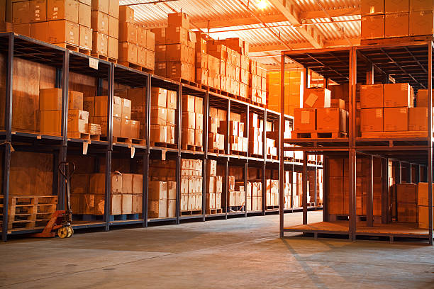 Shelves full of boxes at a stocked warehouse stock photo