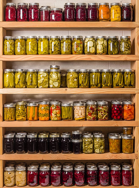 Shelves of canned goods Shelves of homemade preserves and canned goods pantry stock pictures, royalty-free photos & images