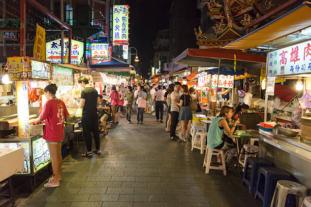 Shilin night market in Taipei Taipei, Taiwan - July 26 2013: People eat street food for dinner in the famous Shilin night market in Taipei, Taiwan capital city night market stock pictures, royalty-free photos & images