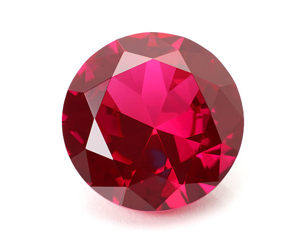 a shiny red ruby gemstone on a white background - edelsteen stockfoto's en -beelden
