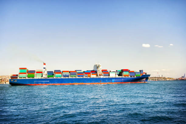 Ship loaded with colorful containers in blue sea