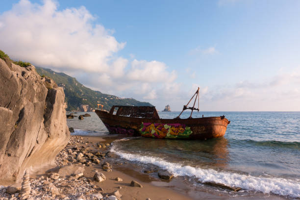 A ship wreck on the shore in Agios Gordios, Corfu island stock photo