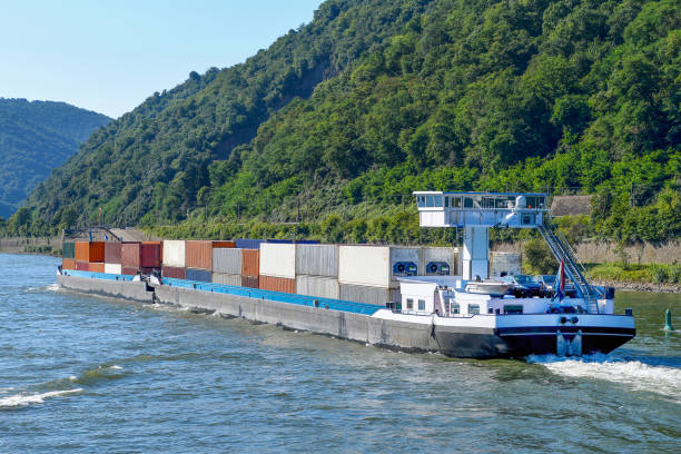 shipping containers on river barge stacking cargo containers on large barge on the Rhine River barge stock pictures, royalty-free photos & images