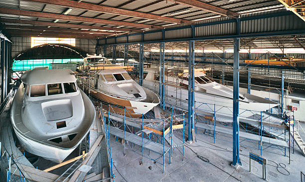 Shipyard in Viareggio, Italy, three yachts under construction, marine industry stock photo