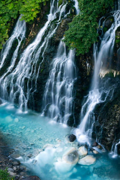 Shirahige nature blue waterfall Biei river in summer. stock photo