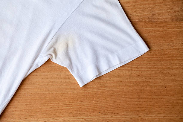 Shirts dirty caused by roll- on deodorant Shirts dirty caused by roll- on deodorant on wooden background armpit stock pictures, royalty-free photos & images
