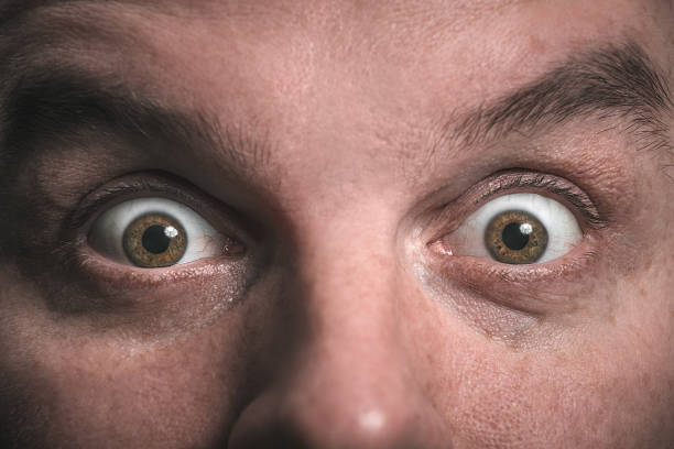 Shock. Surprise. Wide open eyes. Staring. stock photo