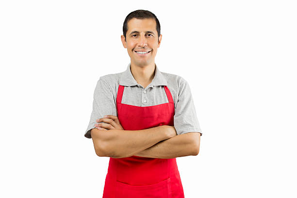 shopman smiling portrait of shopman isolated on white background apron stock pictures, royalty-free photos & images