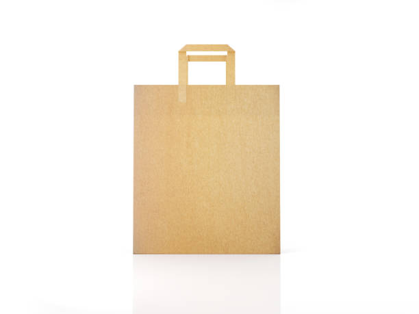 shopping concept: paper shopping bag isolated on white background - paper bag craft imagens e fotografias de stock